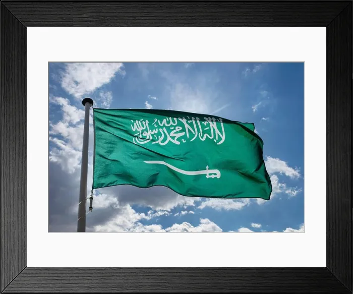 Framed Print : Saudi Arabia flag, Kingdom of Saudi Arabia national symbol on a flagpole waving against blue cloudy sky Framed Print : Saudi Arabia flag, Kingdom of Saudi Arabia national symbol on a flagpole waving against blue cloudy sky