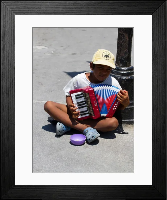 Framed Print : A street beggar or gypsy playing a small hand organ to try and raise donations from the public Framed Print : A street beggar or gypsy playing a small hand organ to try and raise donations from the public