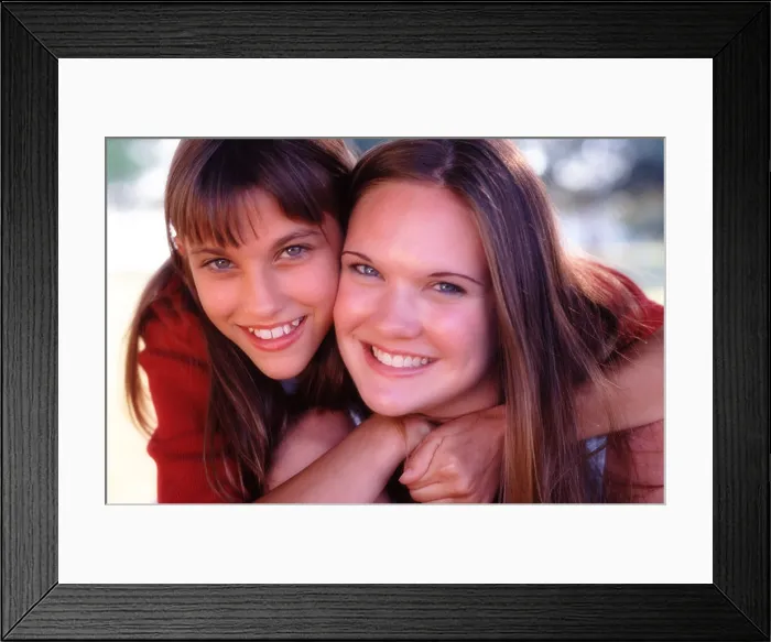 Framed Print : Portrait of sisters hugging Framed Print : Portrait of sisters hugging