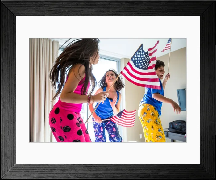 Framed Print : Hispanic children jumping with American flags Framed Print : Hispanic children jumping with American flags