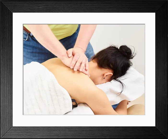 Framed Print : Massage, professional masseur and a woman customer Framed Print : Massage, professional masseur and a woman customer