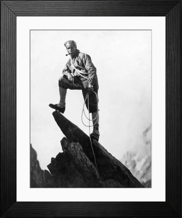 Framed Print : Switzerland: c. 1925. A mountaineer takes a break on a pinnacle of Mount Matterhorn Framed Print : Switzerland: c. 1925. A mountaineer takes a break on a pinnacle of Mount Matterhorn