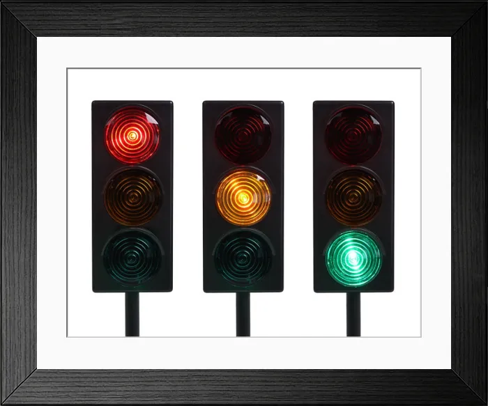 Framed Print : Three traffic lights with red yellow and green lights cut out on white background