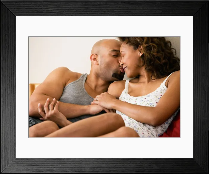 Framed Print : African couple kissing in bed Framed Print : African couple kissing in bed