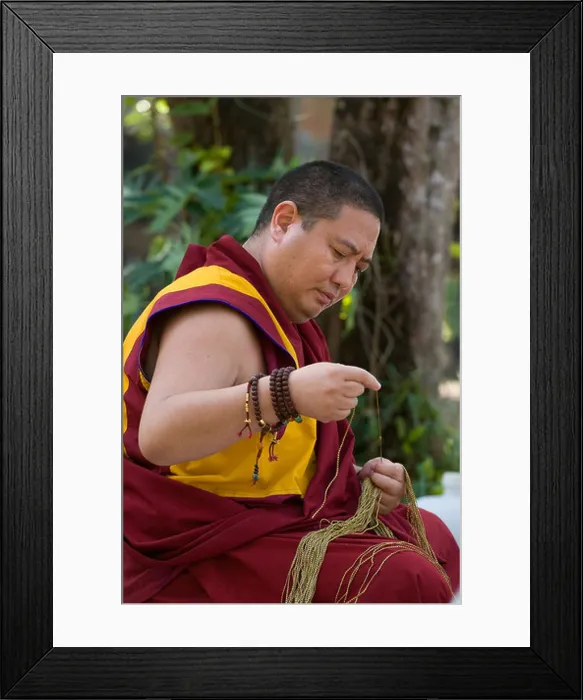 Framed Print : Shechen Rabjam Rinpoche prepares blessing strings at the one year anniversary Puja at Golden Buddha Beach THAILAND Framed Print : Shechen Rabjam Rinpoche prepares blessing strings at the one year anniversary Puja at Golden Buddha Beach THAILAND