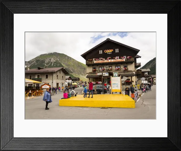 Framed Print : LIVIGNO, ITALY - AUGUST 1: Tourists walk on streets of duty-free area on 1 August 2016 in Livigno, Italy Framed Print : LIVIGNO, ITALY - AUGUST 1: Tourists walk on streets of duty-free area on 1 August 2016 in Livigno, Italy
