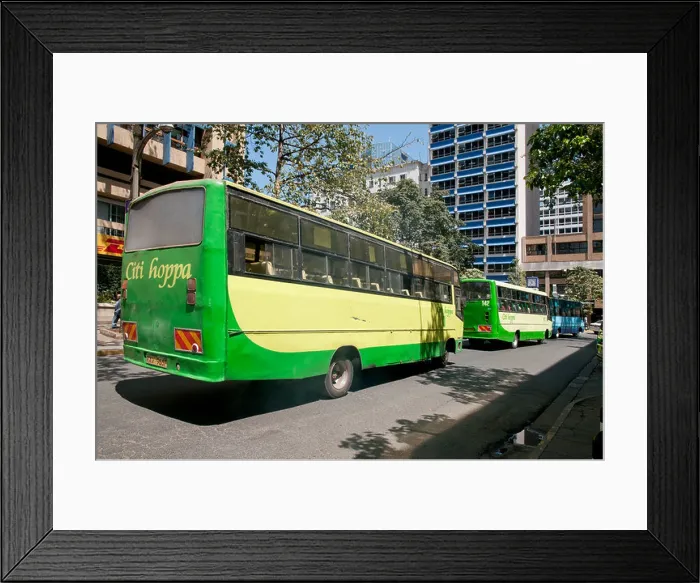 Framed Print : Two green Citi Hoppa Buses and blue KBS Kenya Bus Service bus on Simba Street in central Nairobi Kenya Framed Print : Two green Citi Hoppa Buses and blue KBS Kenya Bus Service bus on Simba Street in central Nairobi Kenya