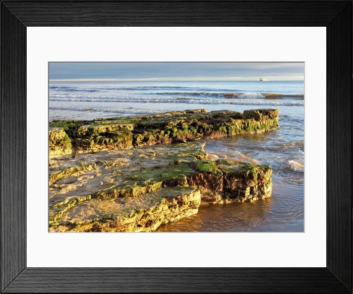 Framed Print : Rocks protrude out into the North Sea on Roker Beach near Sunderland in Tyne and Wear Framed Print : Rocks protrude out into the North Sea on Roker Beach near Sunderland in Tyne and Wear