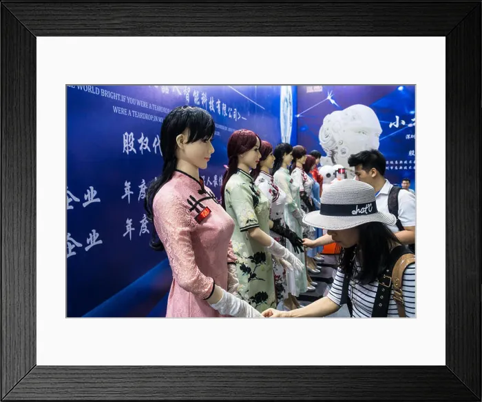 Framed Print : Human-like robot (humanoid robot) touch exhibit at technology fair in Shenzhen, China Framed Print : Human-like robot (humanoid robot) touch exhibit at technology fair in Shenzhen, China