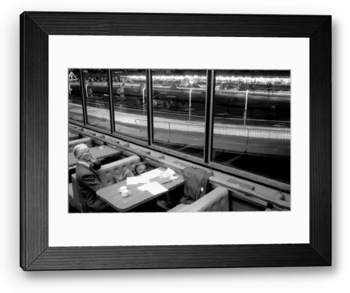 Framed Print : A man waits for the race to start at Walthamstow Greyhound Racing Track, London Framed Print : A man waits for the race to start at Walthamstow Greyhound Racing Track, London