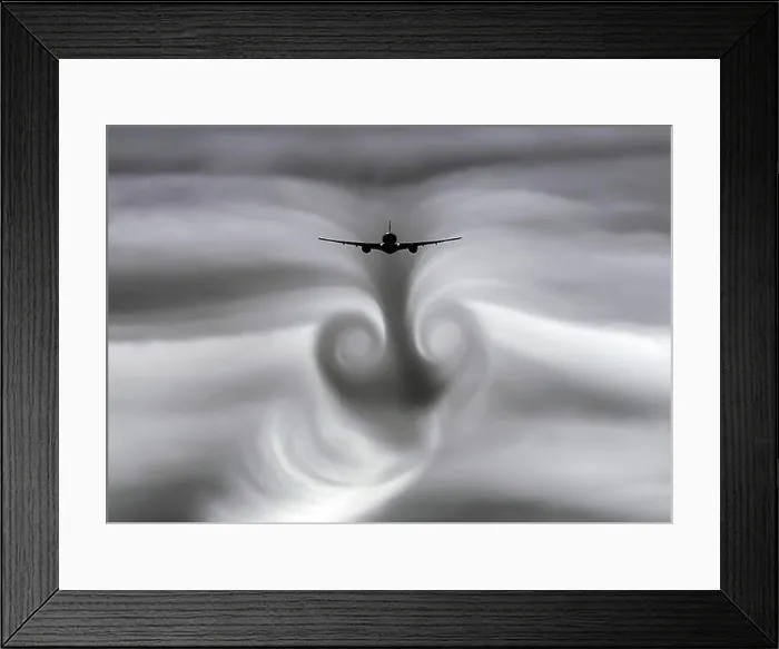 Framed Print : The turbulence of the clouds left by the plane during Framed Print : The turbulence of the clouds left by the plane during