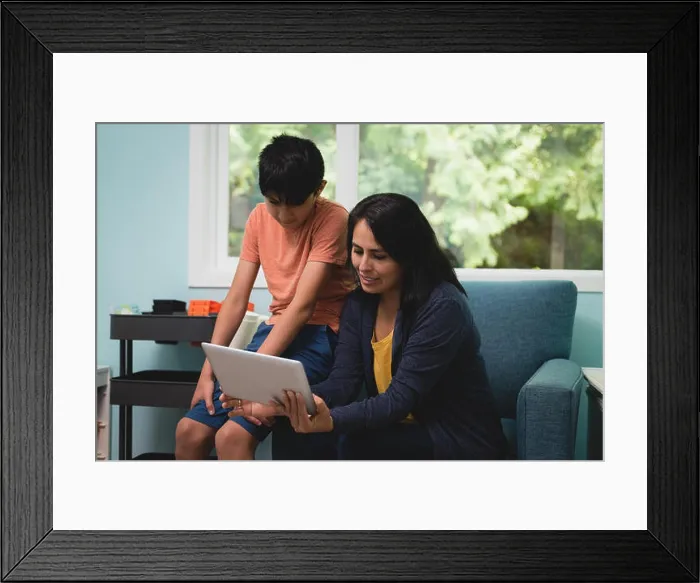 Framed Print : Mother and son having video call on mobile phone Framed Print : Mother and son having video call on mobile phone