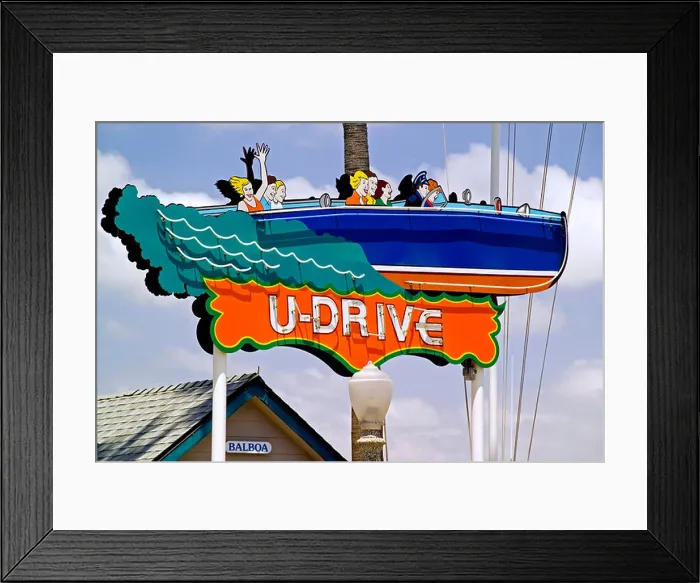 Framed Print : A vintage 'U-Drive' sign has been restored with fresh paint to advertise rentals for boating around Newport Harbor Framed Print : A vintage 'U-Drive' sign has been restored with fresh paint to advertise rentals for boating around Newport Harbor
