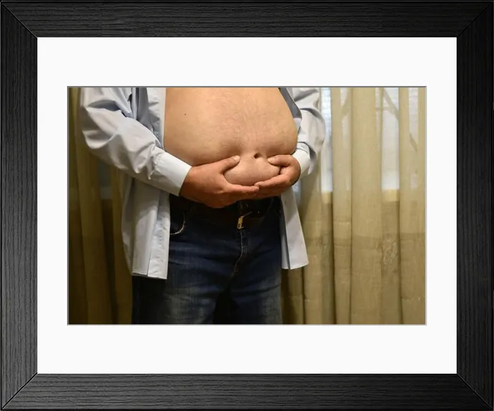 Framed Print : Fat man with a big belly. High quality photo Framed Print : Fat man with a big belly. High quality photo