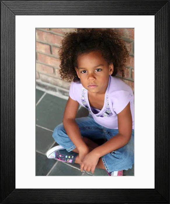 Framed Print : beautiful little african-american girl seated in natural light Framed Print : beautiful little african-american girl seated in natural light