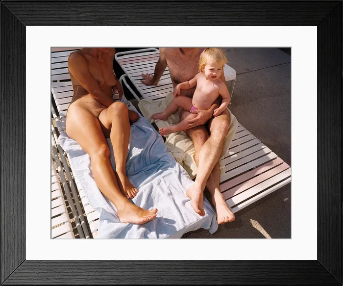 Framed Print : A family of nudists relax on holiday Framed Print : A family of nudists relax on holiday