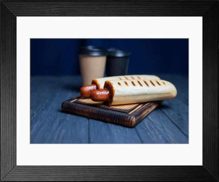 Framed Print : french hot dog in a roll with ketchup sauce with a coffee drink in a glass Framed Print : french hot dog in a roll with ketchup sauce with a coffee drink in a glass