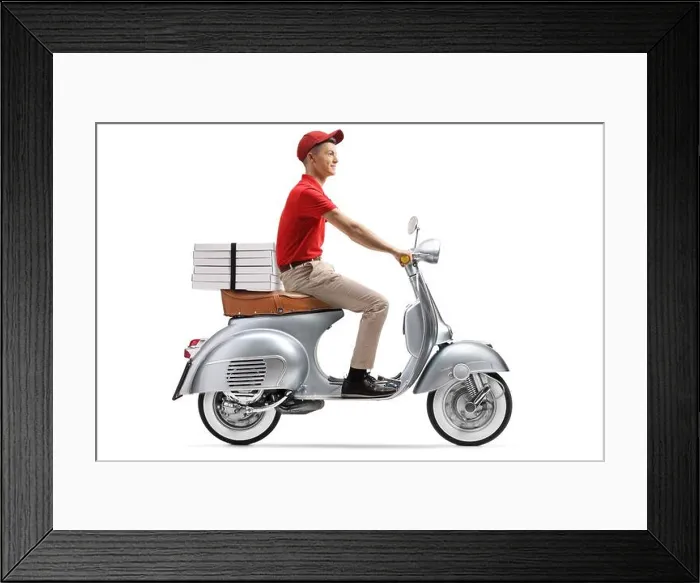 Framed Print : Full length shot of a delivery guy delivering pizza with a scooter isolated on white background Framed Print : Full length shot of a delivery guy delivering pizza with a scooter isolated on white background