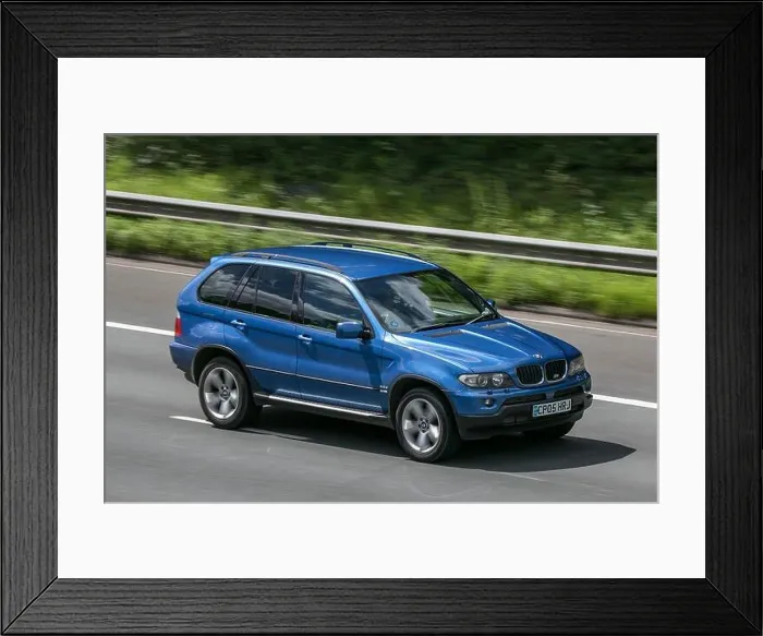Framed Print : A 2005 BMW X5 Sport D Auto Blue Car SUV Diesel driving on the M6 motorway near Preston in Lancashire, UK Framed Print : A 2005 BMW X5 Sport D Auto Blue Car SUV Diesel driving on the M6 motorway near Preston in Lancashire, UK
