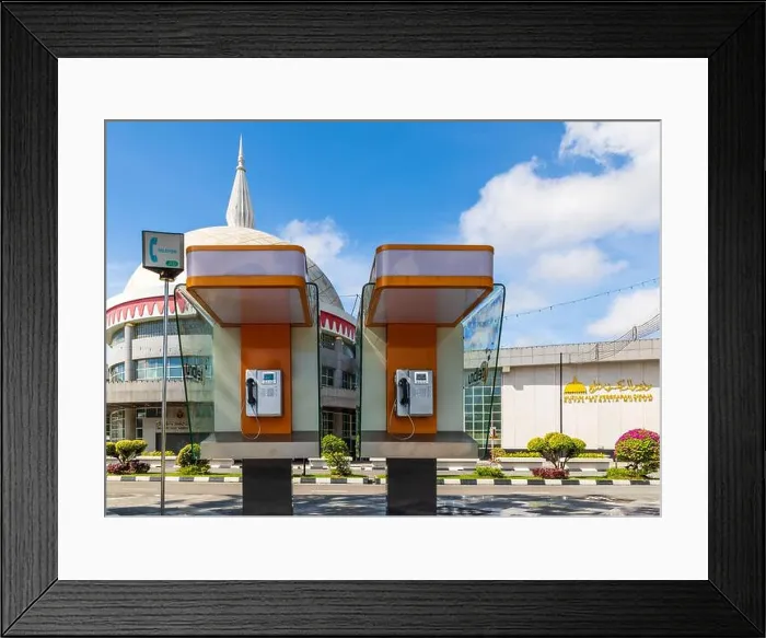 Framed Print : Phone booths of TELBRU (Telekom Brunei) in front of the Royal Regalia Museum (malay) Framed Print : Phone booths of TELBRU (Telekom Brunei) in front of the Royal Regalia Museum (malay)