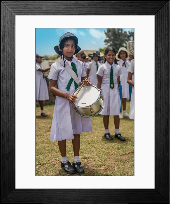 Framed Print : A Sri Lankan girls school band practice as they perform for the tourists at Galle Fort in Southern Sri Lanka