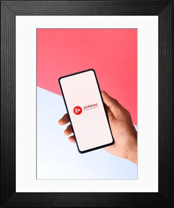 Framed Print : Assam, india - April 10, 2021 : Jio news logo on phone screen stock image Framed Print : Assam, india - April 10, 2021 : Jio news logo on phone screen stock image