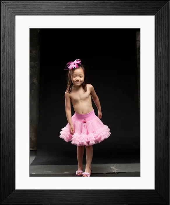 Framed Print : Young Asian twins dancing and performing gymnastics Framed Print : Young Asian twins dancing and performing gymnastics