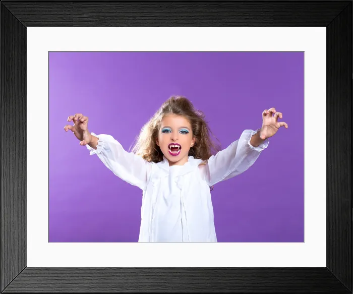 Framed Print : Children vampire makeup kid girl on purple background Framed Print : Children vampire makeup kid girl on purple background