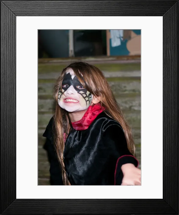 Framed Print : Little Girl Wearing Halloween Face Paint and Costume Pulling an Scary Face Framed Print : Little Girl Wearing Halloween Face Paint and Costume Pulling an Scary Face
