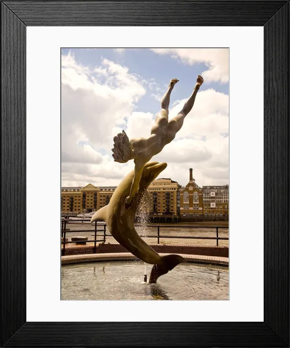 Framed Print : Dolphin and Boy Stature, Tower Bridge from St Katherines Dock on the North Bank of the River Thames, London, UK Framed Print : Dolphin and Boy Stature, Tower Bridge from St Katherines Dock on the North Bank of the River Thames, London, UK