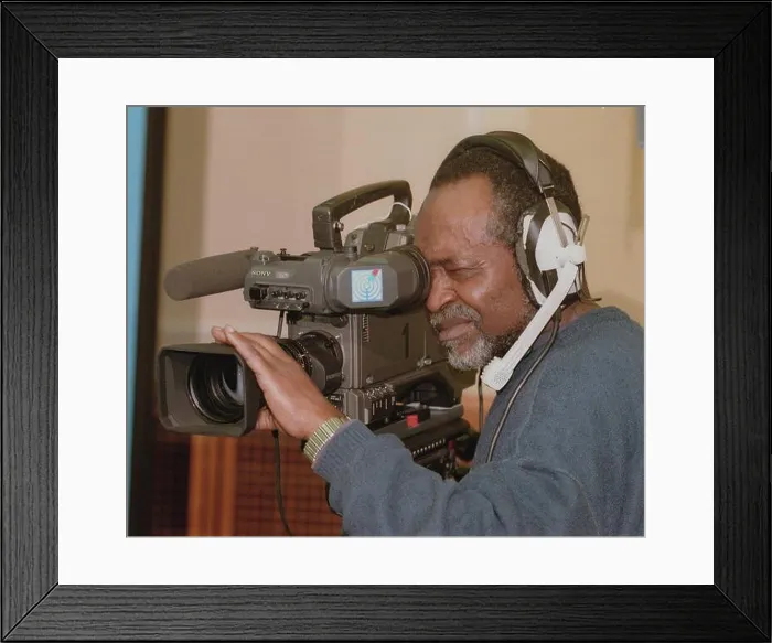 Framed Print : Berlin / Foreigners / Africa / Professions / Press 1998 Cameraman of SFB / RBB from Africa Framed Print : Berlin / Foreigners / Africa / Professions / Press 1998 Cameraman of SFB / RBB from Africa