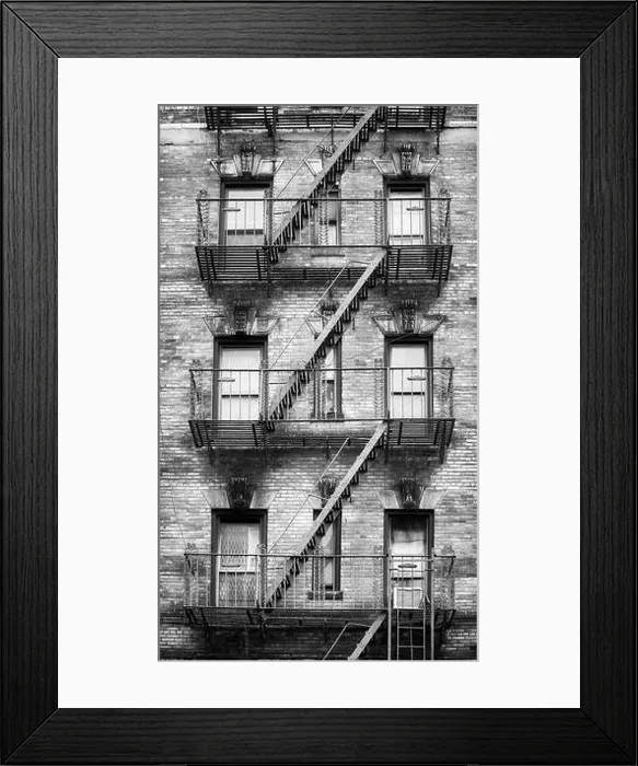 Framed Print : Black and white picture of fire escapes, one of the New York City symbols, USA Framed Print : Black and white picture of fire escapes, one of the New York City symbols, USA