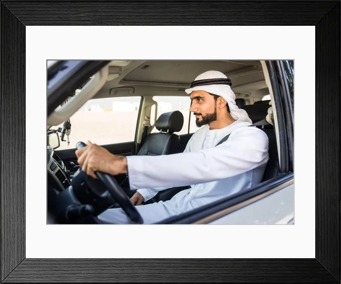 Framed Print : Handsome arabic man driving a car Framed Print : Handsome arabic man driving a car