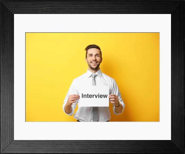 Framed Print : Young man posing with paper on yellow background Framed Print : Young man posing with paper on yellow background