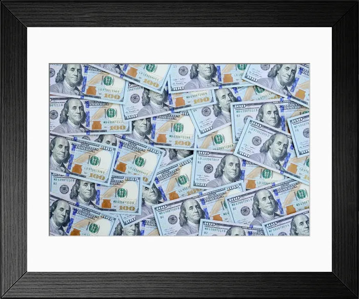 Framed Print : A large number of US dollar bills of a new design with a blue stripe in the middle. Top view Framed Print : A large number of US dollar bills of a new design with a blue stripe in the middle. Top view