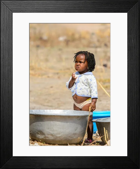 Framed Print : TECHIMAN, GHANA - JAN 15, 2017: Unidentified Ghanaian beautiful little girl near a basin on the Washing Day Framed Print : TECHIMAN, GHANA - JAN 15, 2017: Unidentified Ghanaian beautiful little girl near a basin on the Washing Day