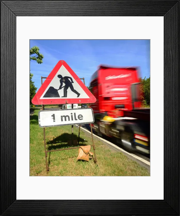 Framed Print : traffic passing roadworks warning sign one mile ahead on the A64 york yorkshire united kingdom Framed Print : traffic passing roadworks warning sign one mile ahead on the A64 york yorkshire united kingdom