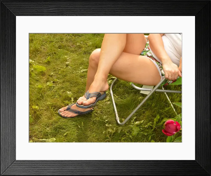 Framed Print : Dirty flip-flops and feet on grass, woman sitting and resting in chair in her garden after hard work Framed Print : Dirty flip-flops and feet on grass, woman sitting and resting in chair in her garden after hard work