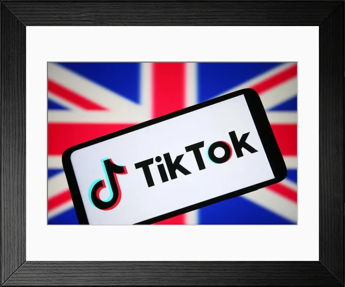 Framed Print : In this photo illustration, a TikTok logo is seen on a smartphone and flag of United Kingdom (UK) in the background Framed Print : In this photo illustration, a TikTok logo is seen on a smartphone and flag of United Kingdom (UK) in the background