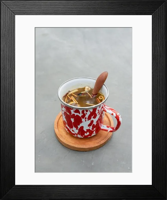 Framed Print : Indonesian herbal drink wedang uwuh served in a stainless cup with forest background Framed Print : Indonesian herbal drink wedang uwuh served in a stainless cup with forest background