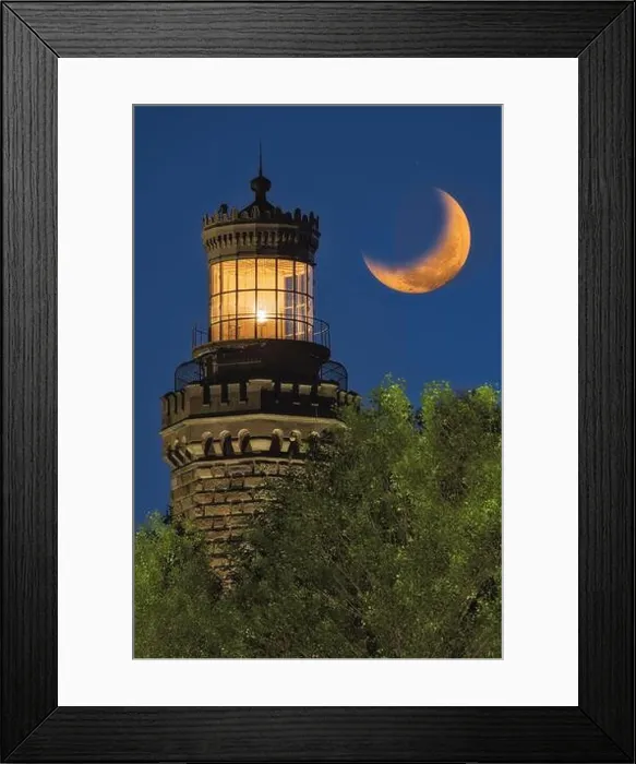 Framed Print : Navesink Twin Lights - Close view to one of the illuminated Lighthouse with the setting moon alongside Framed Print : Navesink Twin Lights - Close view to one of the illuminated Lighthouse with the setting moon alongside
