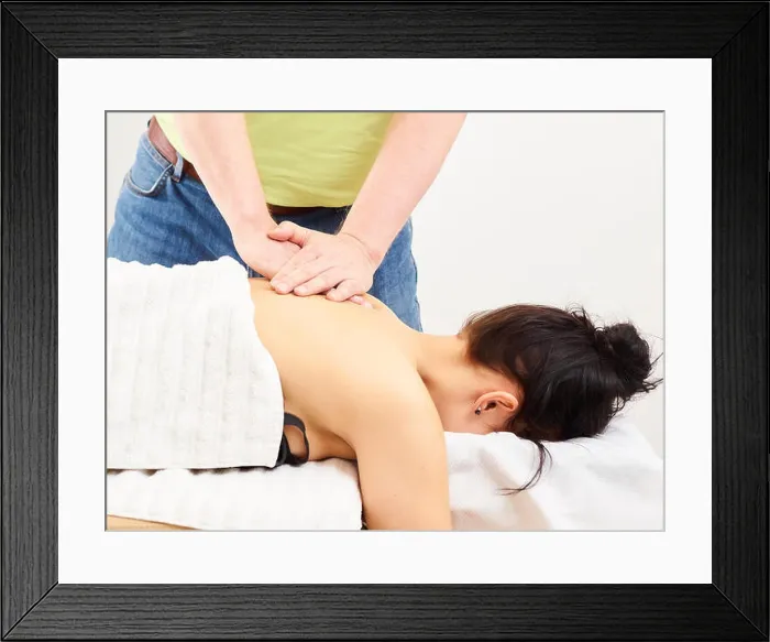 Framed Print : Massage, professional masseur and a woman customer