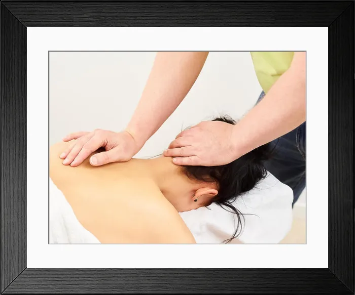 Framed Print : Massage, professional masseur and a woman customer Framed Print : Massage, professional masseur and a woman customer