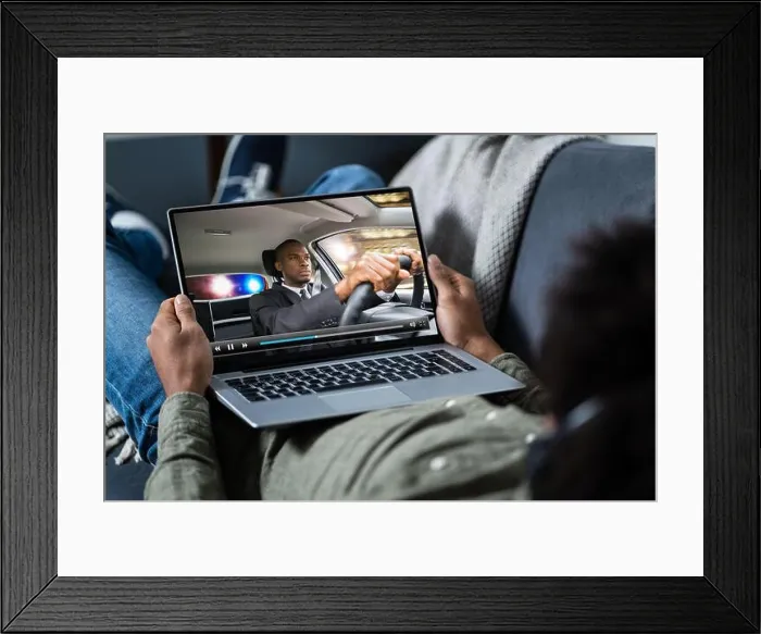 Framed Print : Close-up Of A Man Watching Thriller Movie On Laptop Framed Print : Close-up Of A Man Watching Thriller Movie On Laptop