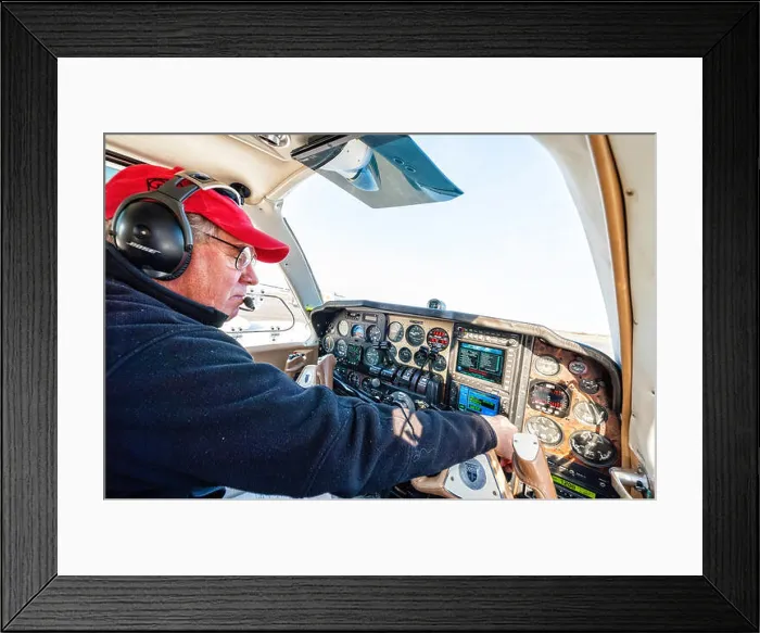 Framed Print : a pilot is doing his pre flight check before taking off in his beechcraft baron Framed Print : a pilot is doing his pre flight check before taking off in his beechcraft baron