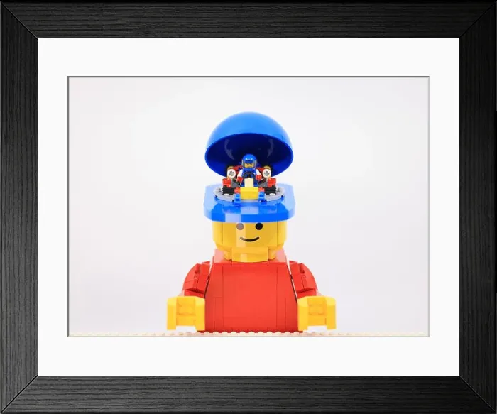 Framed Print : giant man have a mini boy inside his head as a racer Framed Print : giant man have a mini boy inside his head as a racer