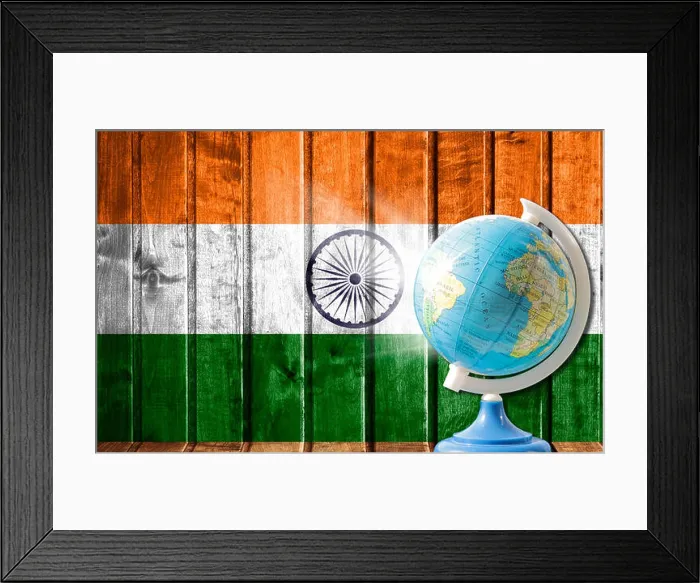 Framed Print : Globe with a world map on a wooden background with the image of the flag of India