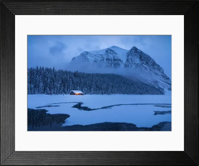 Framed Print : Blue Hour sets in at Lake Louise in mid-January as snow clouds swirl in around Mount Fairview in Banff National Park Framed Print : Blue Hour sets in at Lake Louise in mid-January as snow clouds swirl in around Mount Fairview in Banff National Park