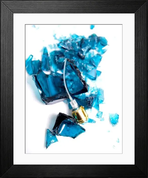 Framed Print : Broken perfume bottle on white background Framed Print : Broken perfume bottle on white background