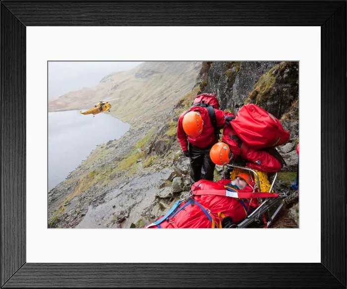 Framed Print : A walker with a compound leg fracture is treated by Langdale / Ambleside Mountain Rescue Team on Pavey Ark in the Lake Framed Print : A walker with a compound leg fracture is treated by Langdale / Ambleside Mountain Rescue Team on Pavey Ark in the Lake